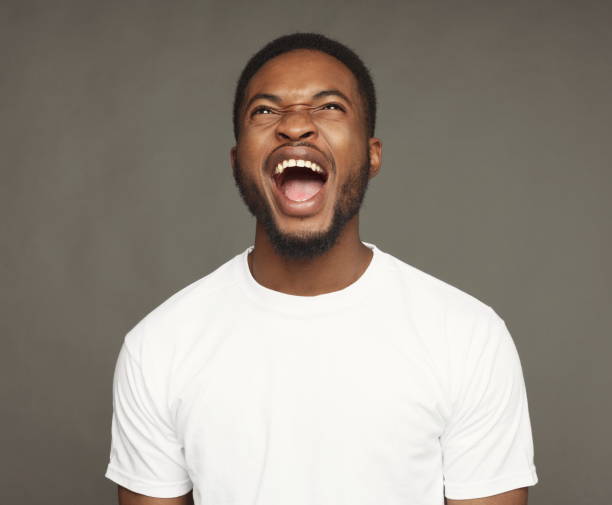istock Black man expressing anger, feeling furious, shouting 928271690