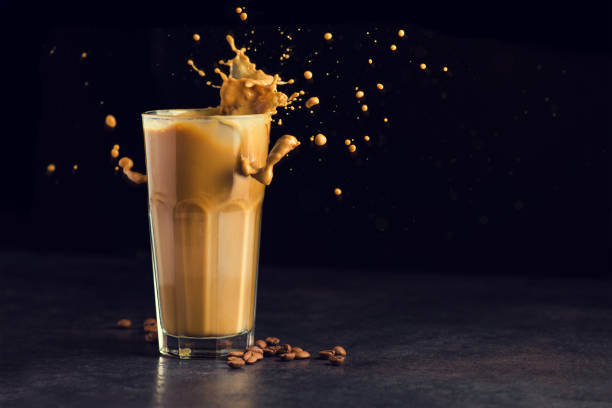 istock Iced latte coffee glass with splash 928275608
