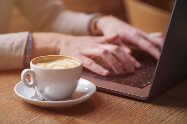 istock Young man enjoying his morning coffee while working 928275898
