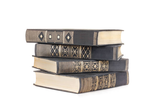 istock stack of four books in a black fabric cover isolated on a white background 928275970