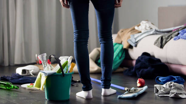 woman horrified by mess left after party in her apartment, cleaning service - frustration emotional stress surprise women imagens e fotografias de stock