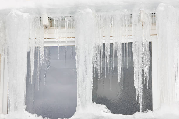 Icicle windows on winter time. Freeze temperatures backgrounds. Horizontal