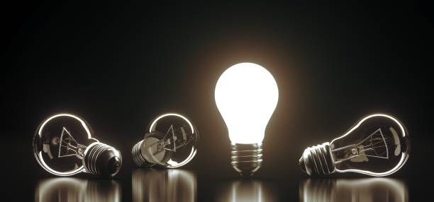 istock Bunch Classic Glass Light Bulbs With One Of Them Lighted 928289664