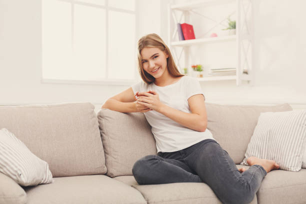 istock Happy smiling woman at home with coffee 928299172