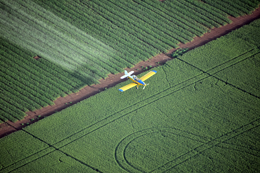 Looking down on a crop duster , Spraying plane