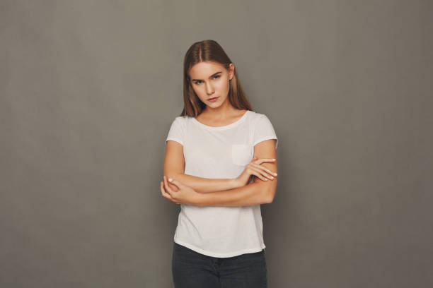 istock Cheerful girl in casual clothes posing at studio 928300840