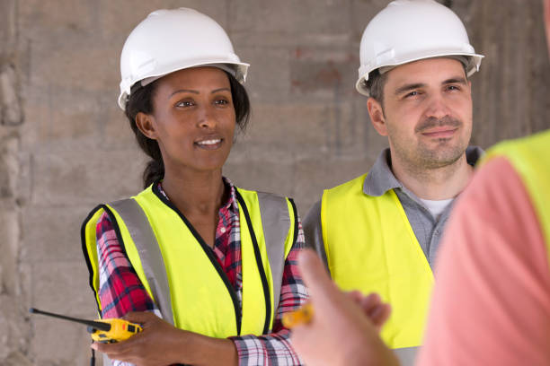 istock Building workers receive briefing from their chief contractor 928306478