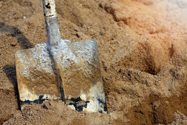 istock old dirty and rusty shovel on sand in construction site work 928308500
