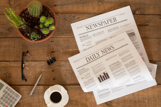istock newspaper over wooden table 928311880