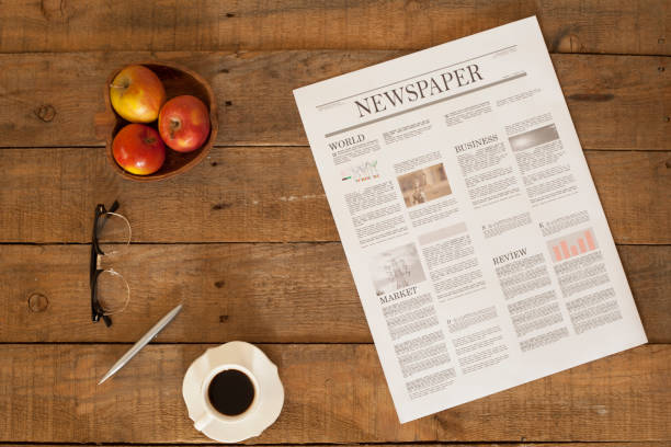 newspaper over wooden table