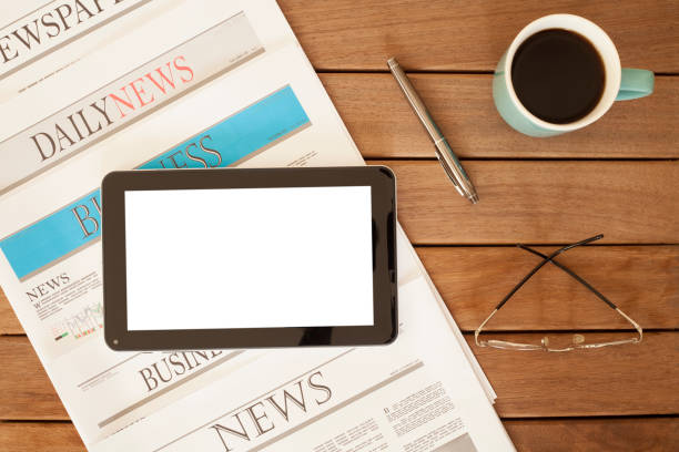istock newspaper over wooden table 928313864