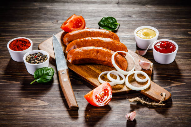 istock Raw sausages on cutting board 928315180