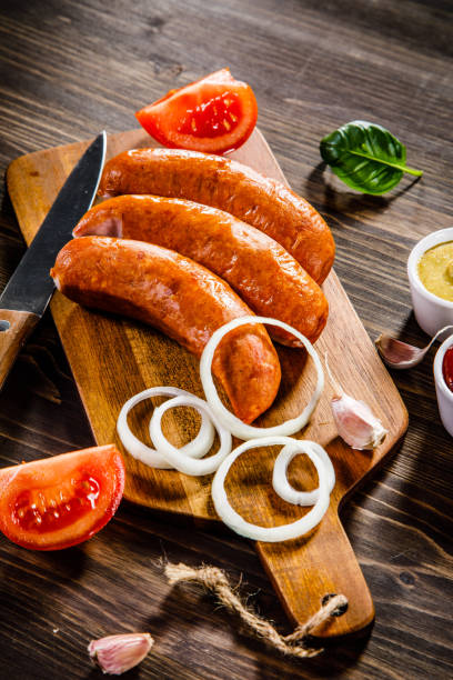istock Raw sausages on cutting board 928315272