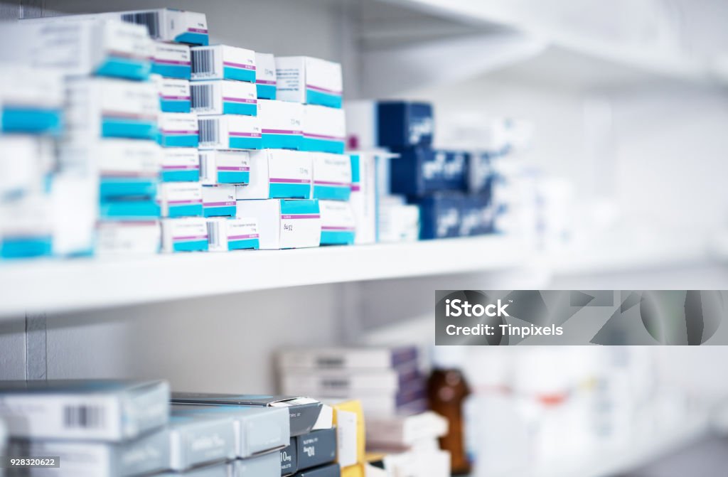 Explore our range of health & pharmacy products Shot of shelves stocked with various medicinal products in a pharmacy Medical Supplies Stock Photo