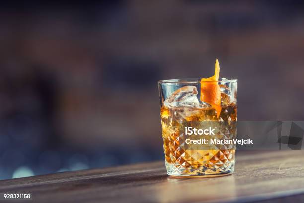 Old Fashioned Classic Cocktail Drink In Crystal Glass On Bar Counter Stock Photo - Download Image Now