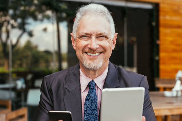 istock Happy Boss Using Tablet and Smartphone Outdoors 928324244