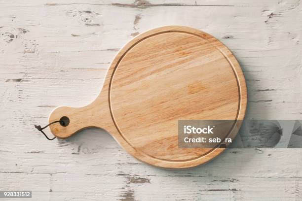 Wooden Chopping Board On Wooden Background Stock Photo - Download Image Now - Cutting Board, Circle, High Angle View