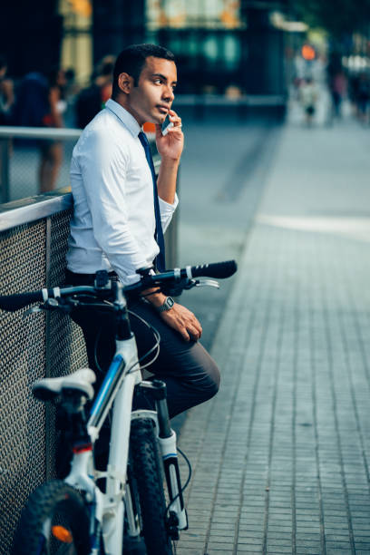 istock Handsome Office Worker Talking on Phone in City 928334200