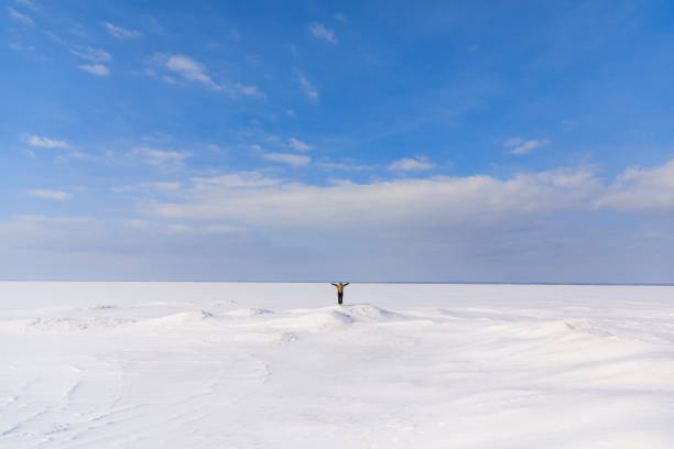 istock Woman on the frozen bay 928334462