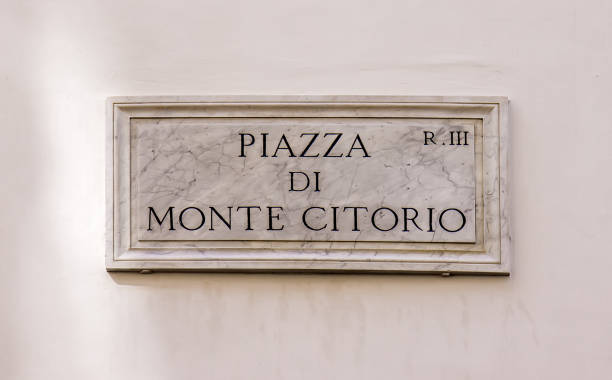 istock Street sign Piazza de Monte Citorio in Rome, Italy 928337254