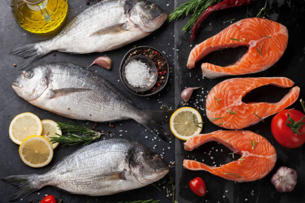 istock Raw salmon and dorado fish fillet 928343518