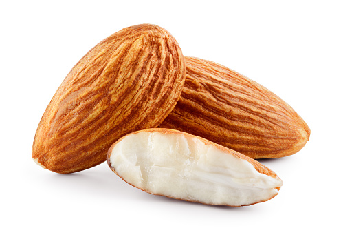 Almond. Three almond nuts isolated on white. Full depth of field.
