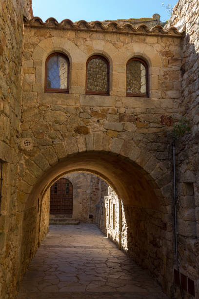 istock Beautiful old stone arcs in Spanish ancient village, Pals, in Costa Brava 928351840