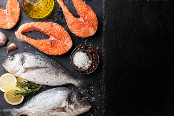 istock Raw salmon and dorado fish fillet 928356260