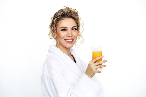 Beautiful woman with glass of orange juice