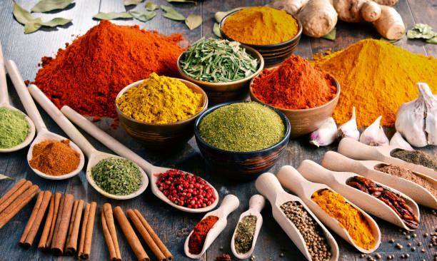 istock Variety of spices and herbs on kitchen table 928360428