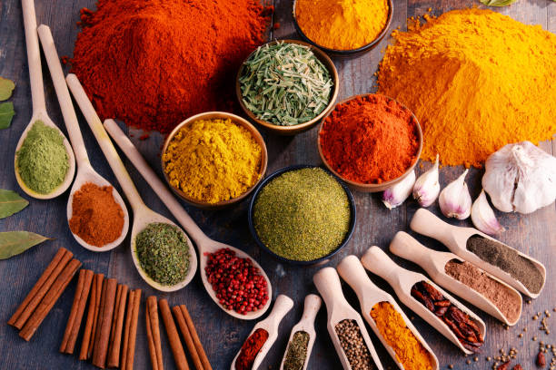 istock Variety of spices and herbs on kitchen table 928362652