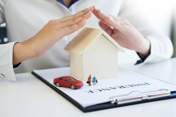 istock Midsection Of Woman Gesturing Over Model House 928363272
