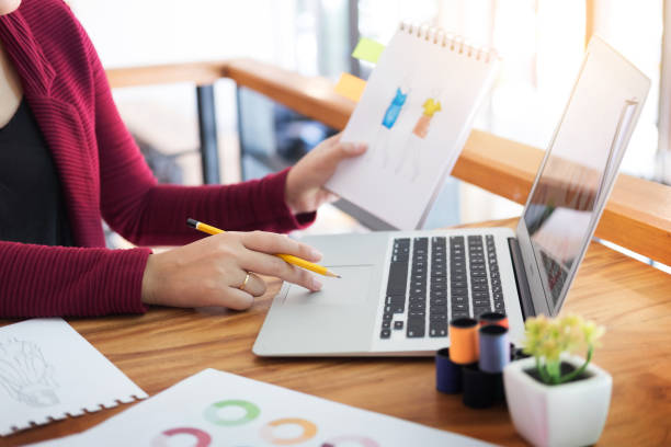 istock Midsection Of Woman Using Laptop On Table 928364224
