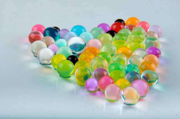 istock orbeez hydrogel balls laying in heart shape on white background 928367738