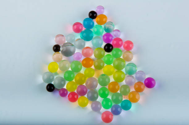 istock Top view. Heap of hydrogel balls lay on white background 928368122
