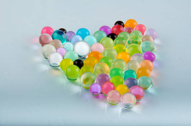 istock Heart made of hydrogel balls laying on white background 928368856