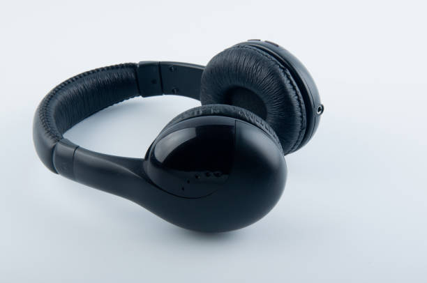 istock Black headphones isolated on white background 928369116