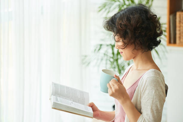 istock Curly Woman Enjoying Weekend at Home 928369664