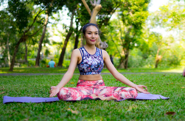 istock Woman Exercising On Grassy Field 928370250