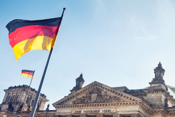 istock German flags at Reichstag, Berlin, Germany 928375386