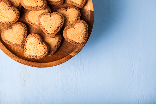 Heart-shaped cookies on a wooden dish. Gift for St. Valentine's Day.