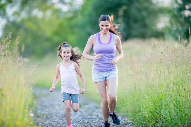 istock Mother And Daughter Running 928379710
