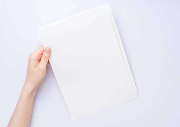 istock girl hands holding paper 928383422