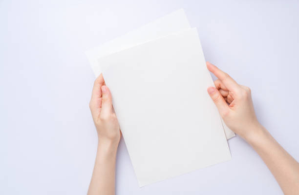 istock girl hands holding paper 928383426