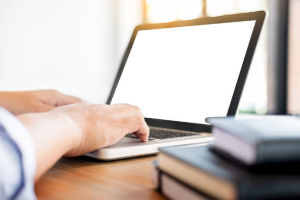 istock Cropped Hands Of Man Using Laptop On Desk 928384020