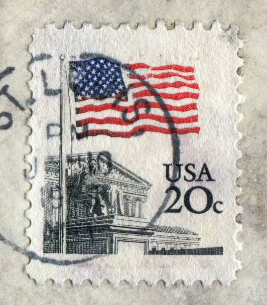 istock USA stamp Stars and stripes flying 928386844