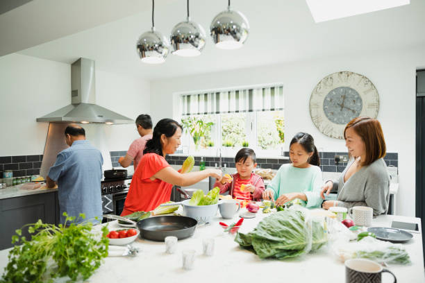 istock Family Preparing a Stir Fry Together 928392398