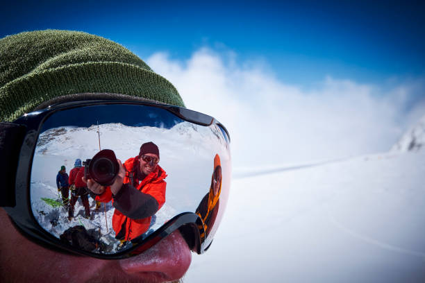 Mountaineers make a selfie through a ski goggles on Denali stock photo