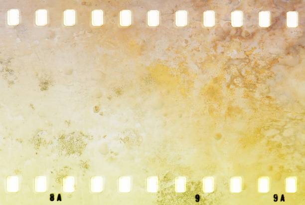 istock Grunge dripping cracked film strip frame in sepia tones. Wall surface. 928399888