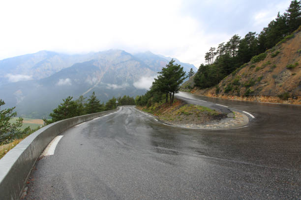 istock Wet road bend in a rainy day 928400404